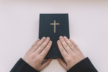 Holy Bible in men's hands. The concept of faith and religion. christian faith. top view - obrazy, fototapety, plakaty