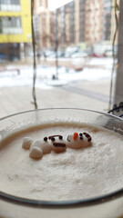 Snowman made from marshmallows and cocoa