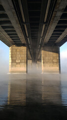 Bridge in frosty fog.