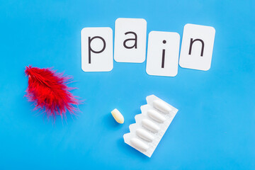 Pharmacy concept. Word pain with red pen and rectal suppositories