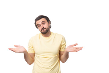 Fototapeta premium young inspired man with a black beard and mustache dressed in a t-shirt