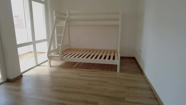 New children rooom with bunk bed. New home. Interior photography. Wooden floor.