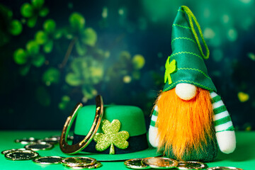 Leprechaun in green suit with red beard on green background. St Patrick Day traditional holidays.