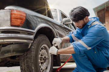 car engine service concept Car mechanic checks car engine with car repair inspection, car service...