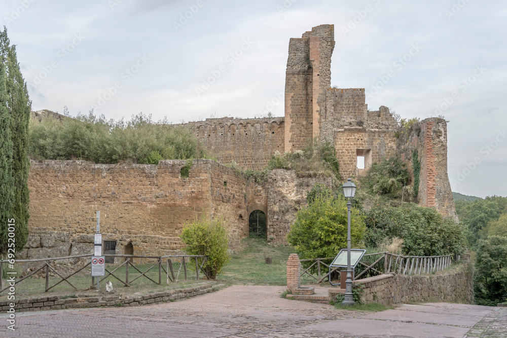 Wall mural ruins of rocca aldobrandesca fortress at medieval village, sovana, italy