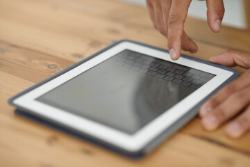 Person, hand and tablet for online connection or technology communication, social media or internet screen. Fingers, close up and typing as digital research or keyboard conversation, email or project
