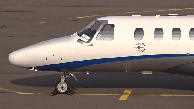 Generic White Unmarked Business Jet Private jet Executive jet Corporate jet Parked at International Airport General Aviation Terminal.