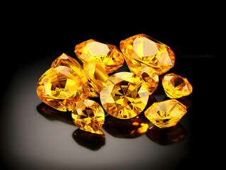 A bunch of shiny yellow sapphire gemstones isolated on a black background. High-resolution