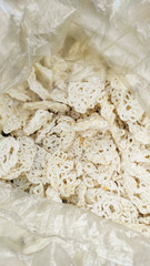 A common Indonesian snack is known as kerupuk or krupuk. These are traditional Indonesian crackers.