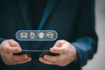 Businessman using computer keyboard with the email, call phone, address, Chat message icons.Customer support hotline Contact us people connection.