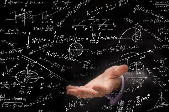businessman writing mathematical formula hand