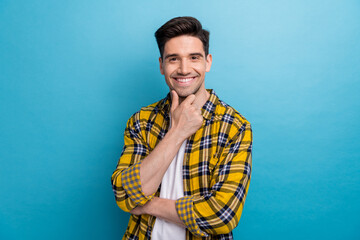 Portrait of good mood minded guy with stubble wear checkered shirt hand on chin think business...