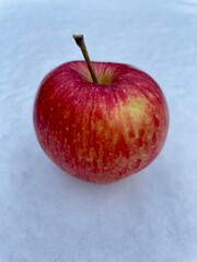 apple on a background of snow