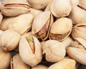 View close-up on a group of salted pistachio nuts with shallow depth of field