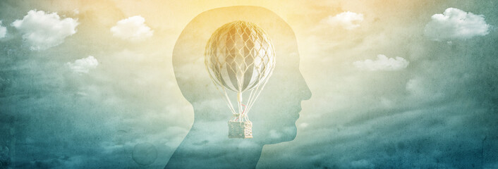 Silhouette of a man with a balloon, an aerostat as a symbol of freedom of thought. Concept , idea...