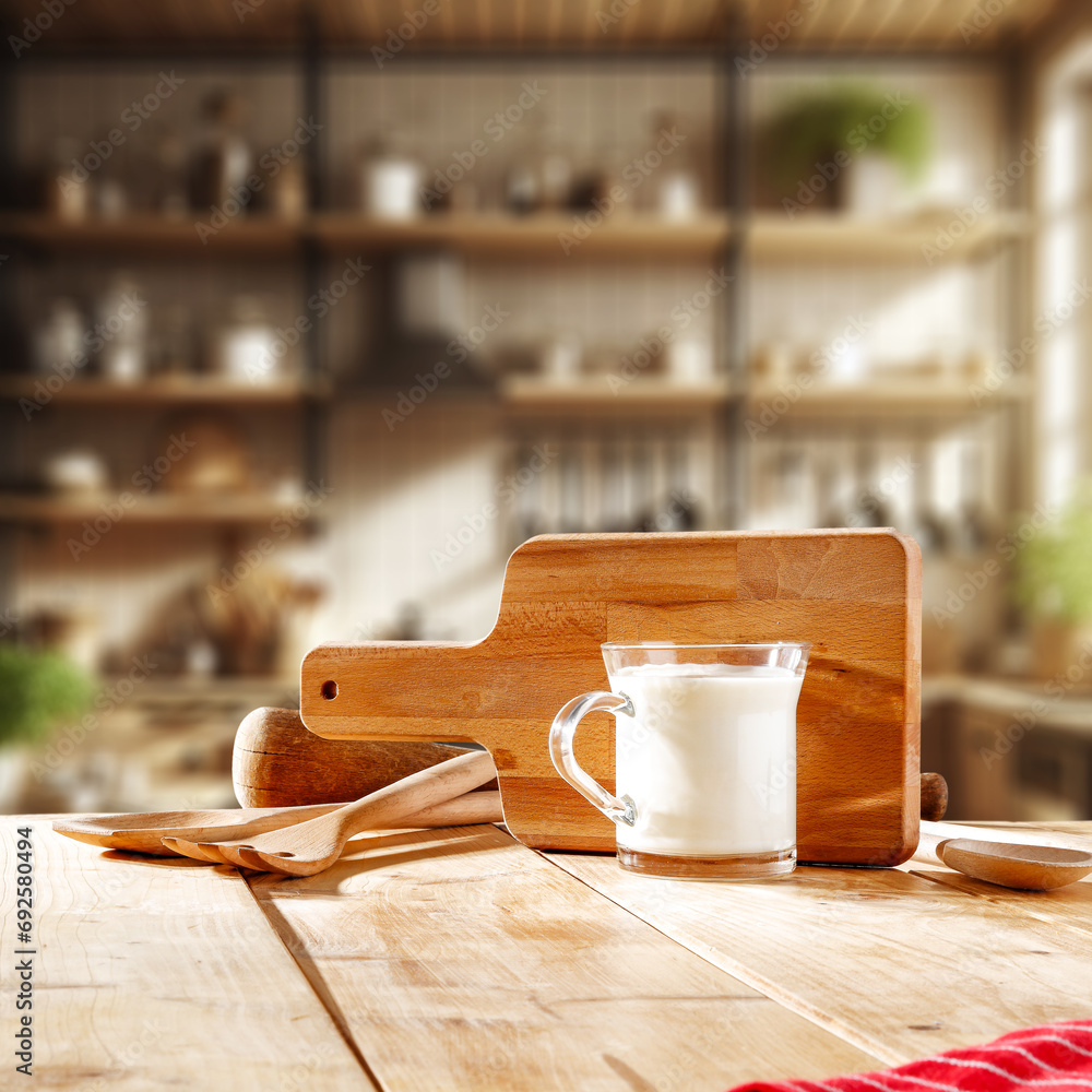 Wall mural photo of milk in kitchen interior and yellow wooden desk. empty space for your decoration and natura