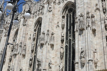 Wonderful marble cathedral in Milan, Italy. Beautiful  religion building with many statues and sculptures in  gothic ancient style.