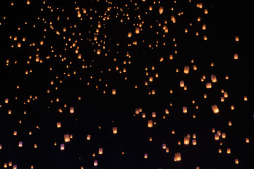 Tourist floating sky lanterns in Yi-Peng (Loy Krathong) festival , Chiang Mai ,Thailand.