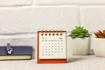 January 2024. Desk calendar for 2024 on the desktop. - obrazy, fototapety, plakaty