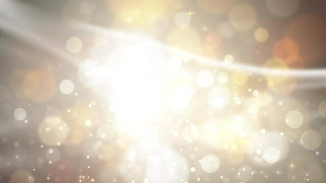 Gold glitter background with defocused bokeh particles lights shiny for luxury christmas or new year holiday greetings.