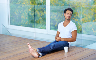 Man, thinking and coffee for breakfast wellness, vacation latte or weekend relax. Male person, cup and caffeine cappuccino in morning or mug drink or happiness in apartment espresso, peace or calm