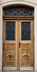 Old vintage wooden yellow door close-up