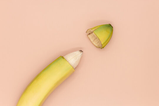 Male circumcision concept, banana with skin cut off