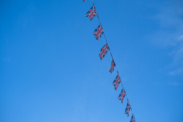 British flags flying for festival, blue sky