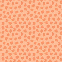 Abstract spots. Leopard skin seamless pattern with color of Peach. Fur of cheetah, jaguar. Fashion and luxury textile design. For print, fabric, backdrop, cover, banner, wrapping paper.