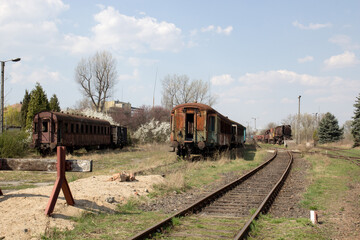 Old rusty cars standing in the abandoned depot