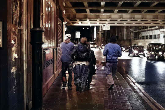 punks fashion men on the street night in London 2000