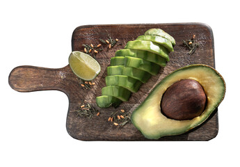 Fresh organic sliced avocado and Sliced avocado halves with lime slice and spices on a wooden...