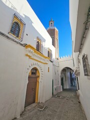 street and minaret of the kasbah mosque in Tangier - 692615089