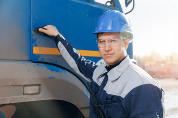 Professional truck driver of cement mixer on background Industry lorry and looking at camera