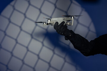 Concept Ban on use of drones. Modern military technology fly robot in hands of soldier army...