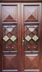Vintage wooden brown door close-up - 692623451