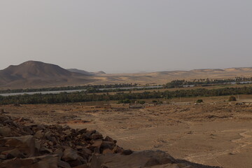 Photographing a rural village from above the mountain in the countryside of northern Sudan