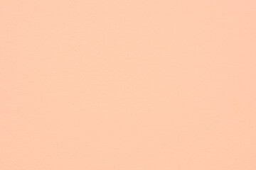 Peach Fuzz toned colour grunge decorative wall background. Art rough stylized texture banner trendy...