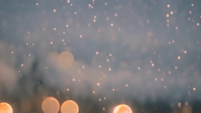 Snow snowflakes particles falling on snow cover. Snow falling on sonw ground bokeh background. Winter wonderland and tranquility.