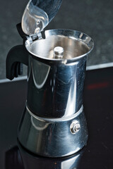 Close-up of a traditional Italian stainless coffee maker