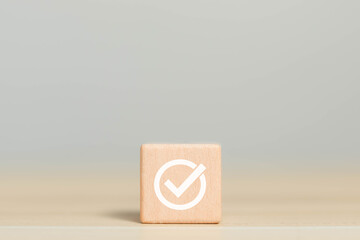 Wooden blocks display checkmarks to summarize task details and compile lists, votes, and to-do...