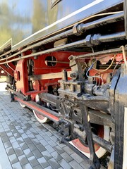 An image of the wheels of a steam locomotive.