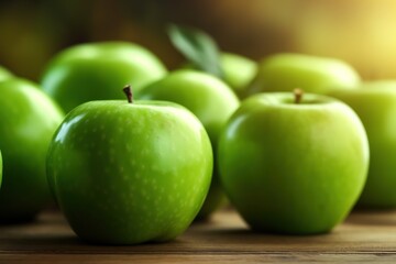 Fresh green apples on brown wooden background