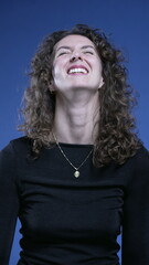 Happy woman close-up face smiling at camera and nodding yes in affirmation, vertical video