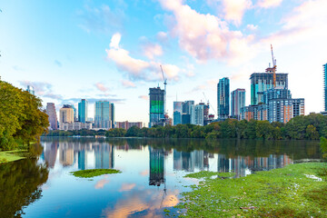 skyline of Austin in early morning light with mirroring city in the colorado river, Texas - obrazy, fototapety, plakaty