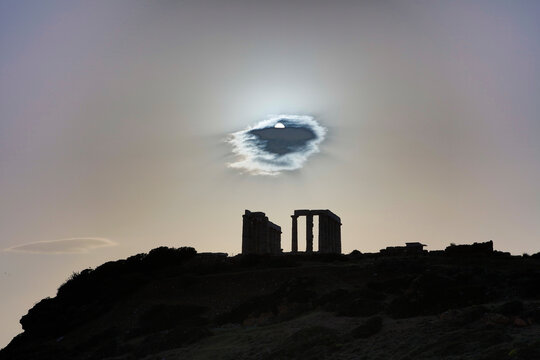 Greece ancient Greek temple at Cape Sounion at sunset on a sunny summer day