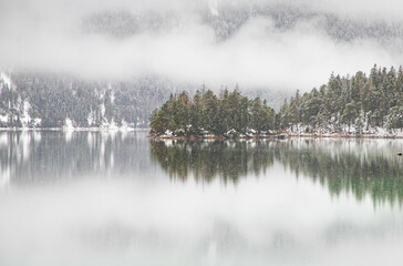 foggy lake in winter snowfall