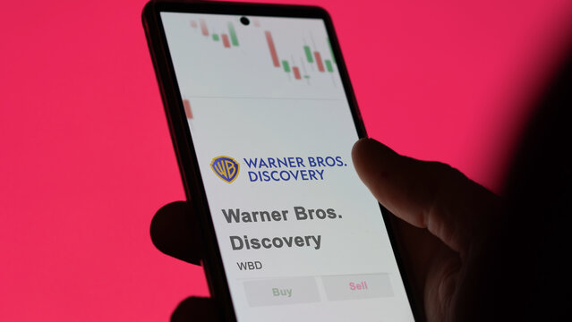 November 30st 2023 New York City, New York. The logo of Warner Bros. Discovery on the screen of an exchange. Warner Bros  Discovery price stocks, $WBD on a device.