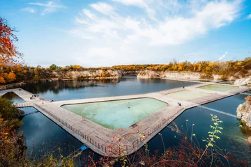 Fotobehang  Swimming, paddling pools, sunbathing platforms on Zakrzowek lake famous landmark in Krakow Poland. © alexanderuhrin