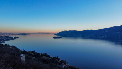 Landscapes with mountains and lakes. Area view with shades of colors, blue water and green meadows